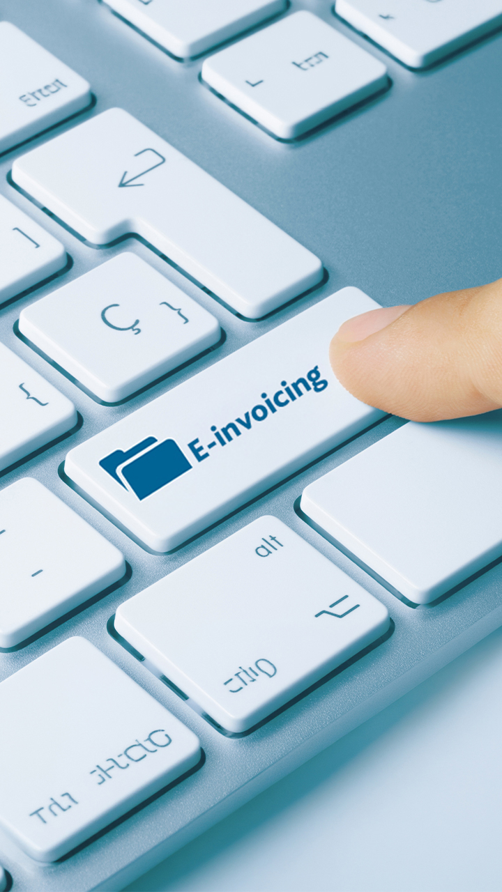 The person presses the button labeled E-Invoice"